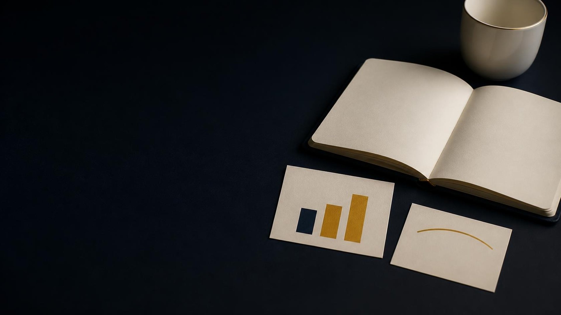 A personal finance still life with a blank notebook, an unlabeled bar chart, and a savings card with no words.