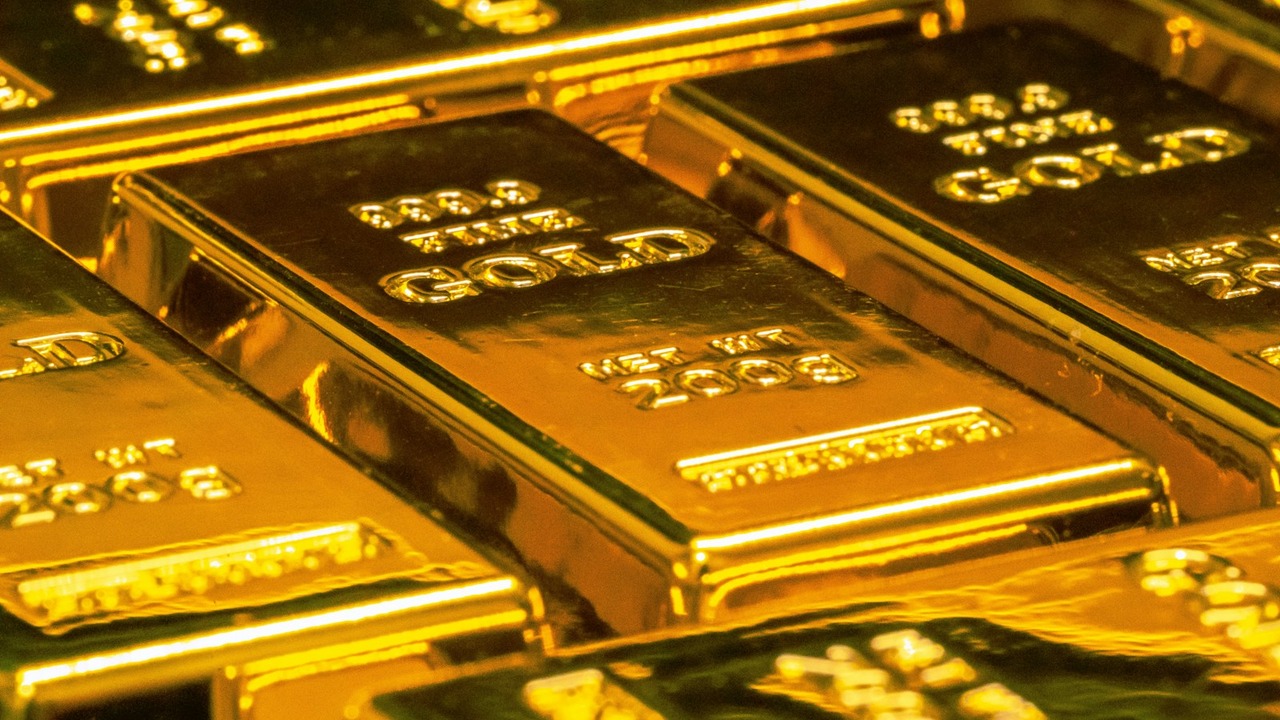 Pure 24K gold bullion bars in secure banking vault
